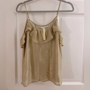 New with tags! Spaghetti strap gold top with ruffle detail. Size L